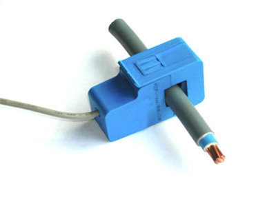Non-invasive split core current sensor clipped around a power cable