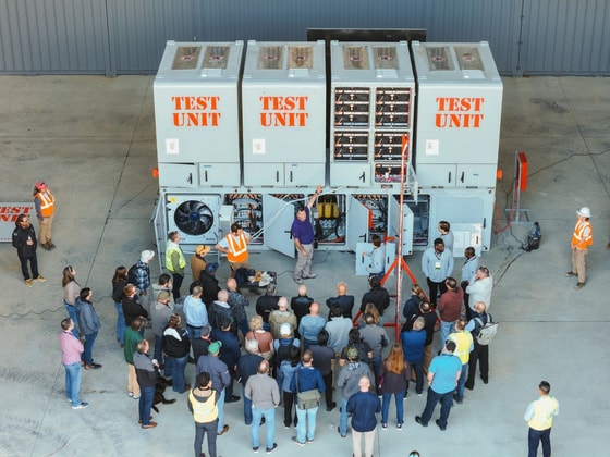 Fire & Risk Alliance symposium attendees at the Fluence Smartstack test units before the public live fire test